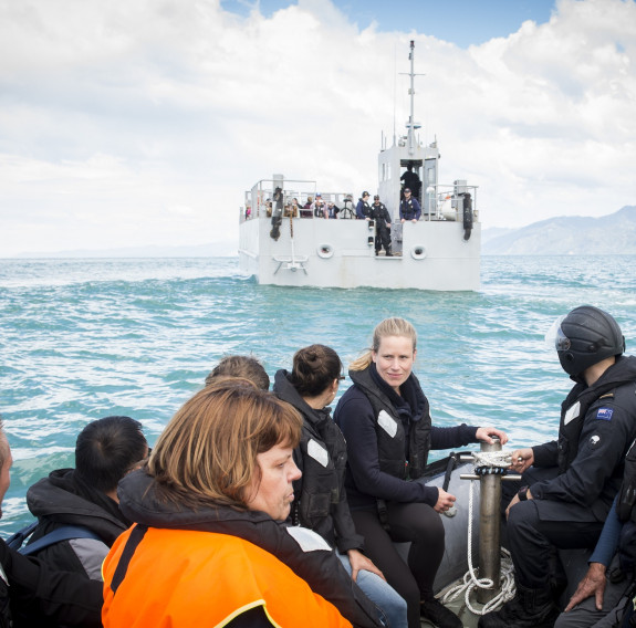 Travellers and locals from Kaikoura on a landing craft mechanism to HMNZS Canterbury as part of the evacuations following a magnitude 7.5 Earthquake