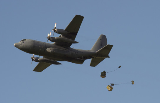 A C-130H(NZ) Hercules aircraft airdrops 5000 litres of bottled water for Kaikoura residents following an earthquake on 14 Nov 16.