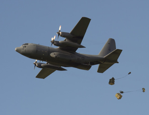 A C-130H(NZ) Hercules aircraft airdrops 5000 litres of bottled water for Kaikoura residents following an earthquake on 14 Nov 16.
