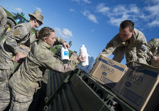 Personnel unload aid supplies from a truck in Kaikoura following a magnitude 7.5 Earthquake.