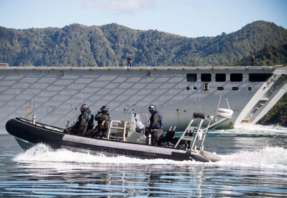 A Rigid Hulled Inflatable Boat conducts a survey of the Marlborough Sounds alongside HMNZS Canterbury as part of Exercise Southern Katipo.