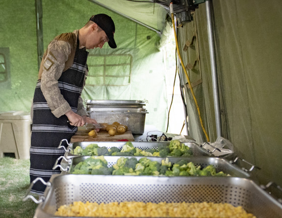 New Zealand Army Chefs from 3 Combat Support Battalion prepare and cook food in the field.