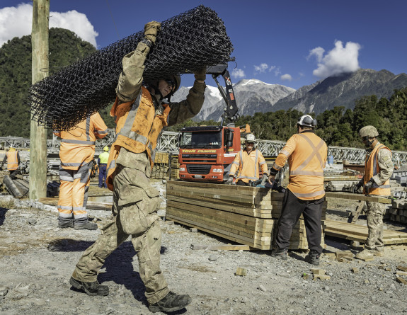NZ Army Engineers helping fix and clean up from the building of the Bailey bridge at Franz Josef.