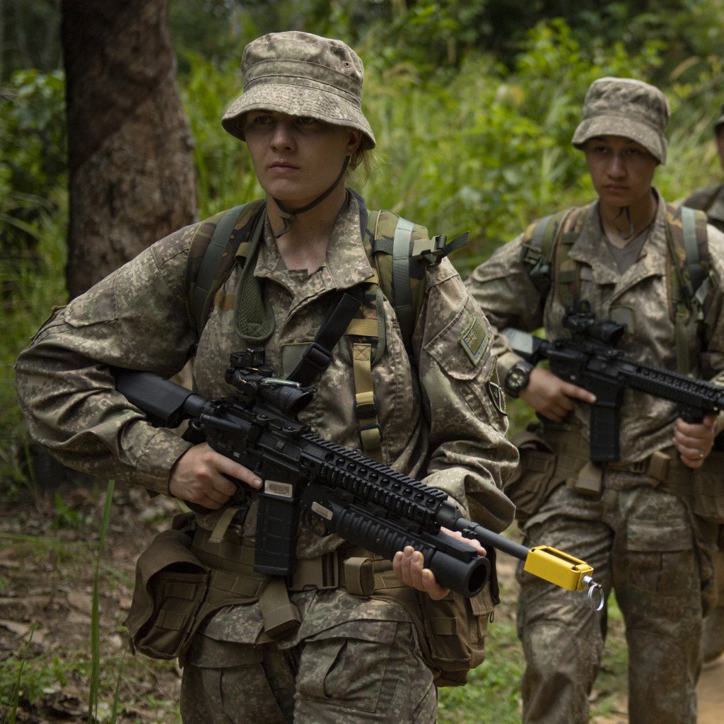 Our personnel in formation march in full gear in the Malaysian Jungle.