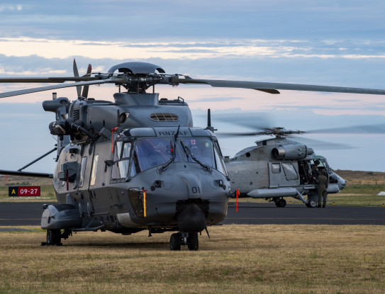 An NH90 hellicopter and Seasprite helicopter on the flight-line. 