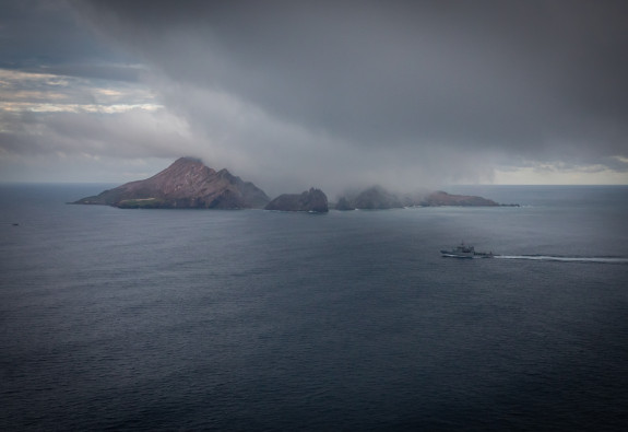 HMNZS Wellington sails near the vicinity of White Island