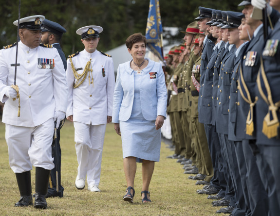 Dame Patsy Reddy inspects the tri-service guard of honour at the Waitangi Treaty Grounds