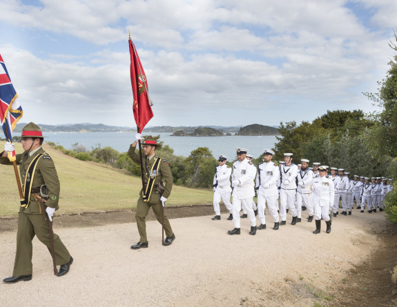 A tri service royal guard of honour marches onto the Waitangi Treaty Grounds