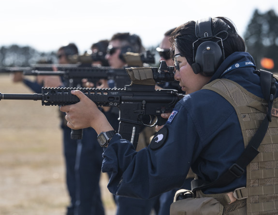 Air Force personnel in a row fire MARS-L Rifles on a weapons range