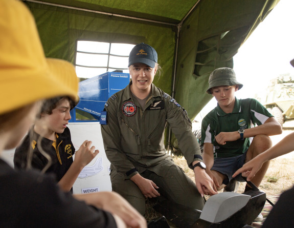 Flight Lieutenant takes a group of local school children through the mechanics of flight as part of a School to Skies team during Wings over Wairarapa 2021.