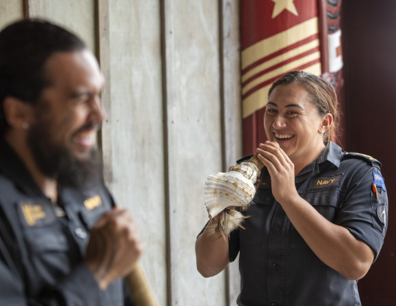 Marae staff and other navy personnel practice using Taonga puoro (Maori musical instruments) at the Marae. 