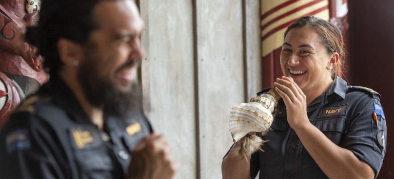 Marae staff and other navy personnel practice using Taonga puoro (Maori musical instruments) at the Marae.