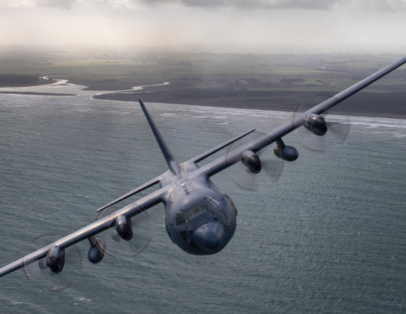 A Royal New Zealand Air Force C-130H(NZ) Hercules aircraft conducts low level tactical flying over the Manawatu on a cloudy day