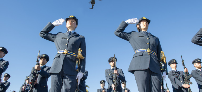 A Royal New Zealand Air Force NH90 helicopter from No.3 Squadron flies overhead Officer Cadets during their graduation parade.