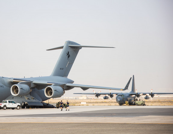 A Royal Australian Air Force C-17 Globemaster III in front of a Royal New Zealand Air Force C-130H(NZ) Hercules aircraft on the Australian Defence Force’s main operating base in the United Arab Emirates. 
