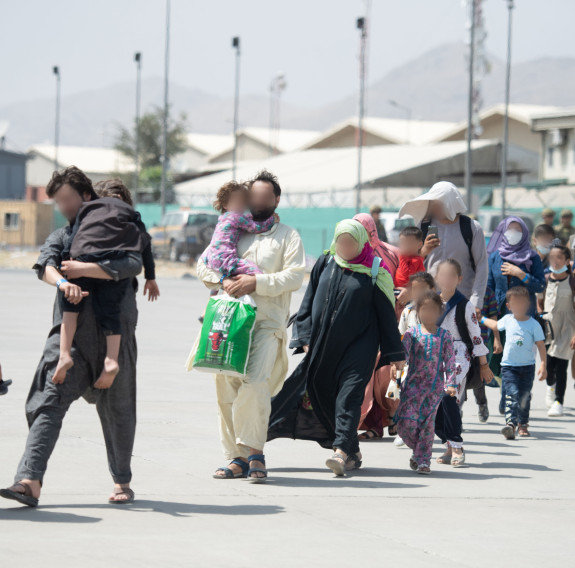 Evacuees board the Hercules aircraft at Hamid Karzai International Airport in Kabul