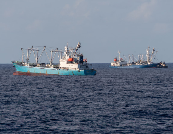 Two boats in the water in blue sky