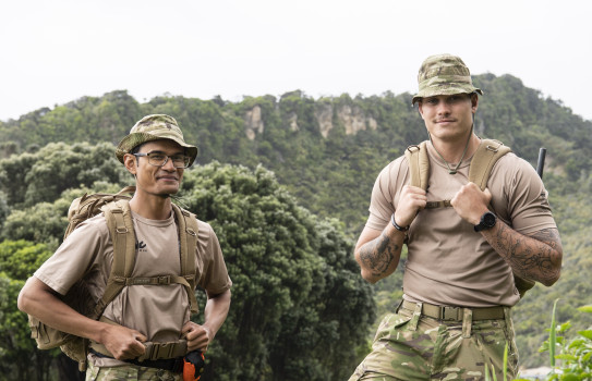 Lance Corporal Ngoc Thang Lam and Private Carl-Jacques Reinecke pictured wearing their military gear, with bush and mountain landscapes in the background.