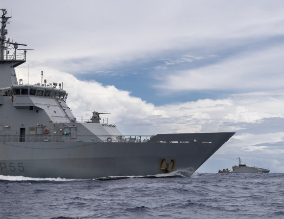 HMNZS Wellington and RFNS Savenaca have collaborated in the maritime border patrol mission known as Operation Calypso - two ships moving through the water one closer to the camera