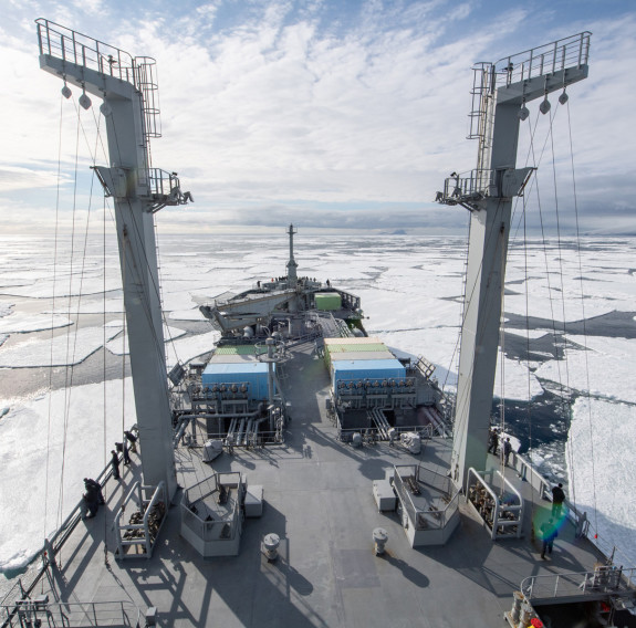 HMNZS Aotearoa sailing in Antarctic waters, breaking through ice. 