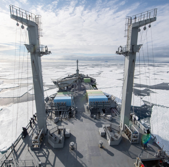 HMNZS Aotearoa sailing in Antarctic waters, breaking through ice.