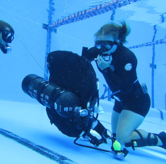 Katrina Koch-Underhill under water carrying out dive training drills in the pool at Devonport Naval Base.