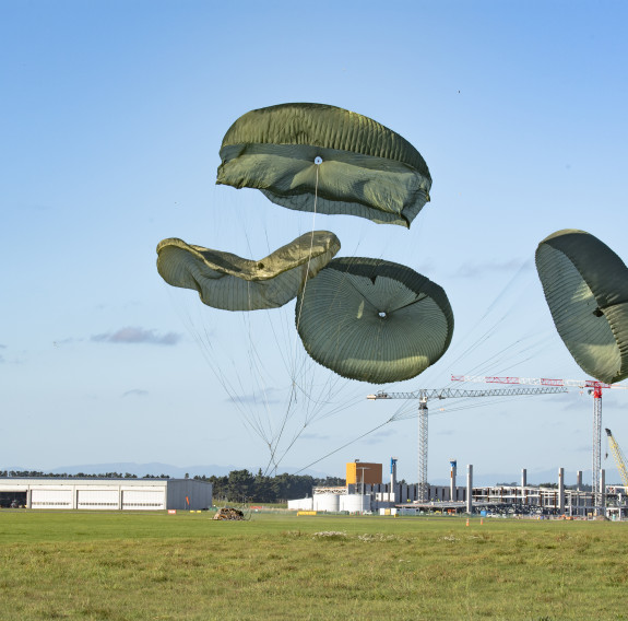 Cargo lands safely at Base Ohakea under four parachutes after being dropped from our Hercules.