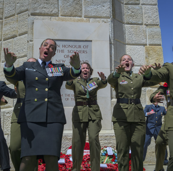 The New Zealand Memorial Service at Chunuk Bair, Gallipoli. NZDF personnel perform the NZDF haka - the faces show them yelling/screaming with passion as they speak the words.