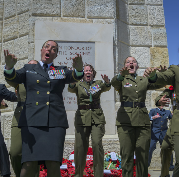 The New Zealand Memorial Service at Chunuk Bair, Gallipoli. NZDF personnel perform the NZDF haka - the faces show them yelling/screaming with passion as they speak the words.