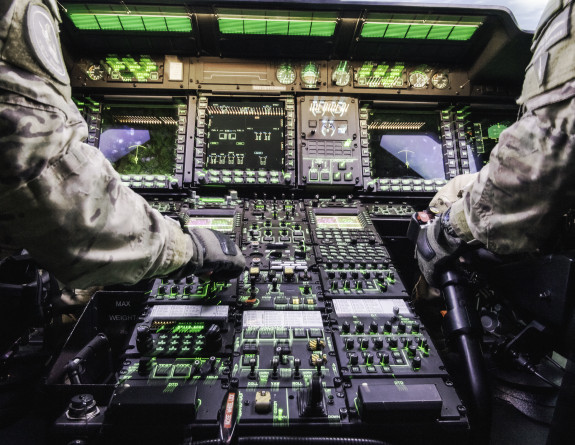 Royal New Zealand Air Force aircrew in the NH90 simulator - you can see two sets of hands working, no faces.