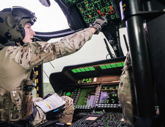 Royal New Zealand Air Force aircrew in the NH90 simulator - they have their hand up switching on a button. 