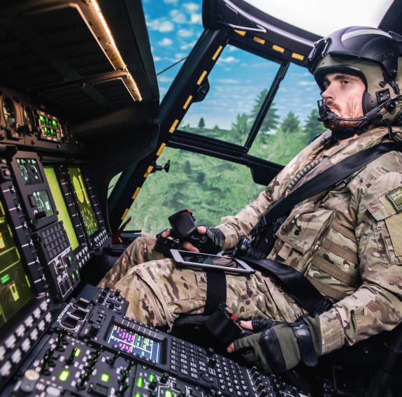 A member of the Royal New Zealand Air Force's No. 3 Squadron in the NH90 simulator. The image is side a side angle, taken on the lefthand side of the person. 