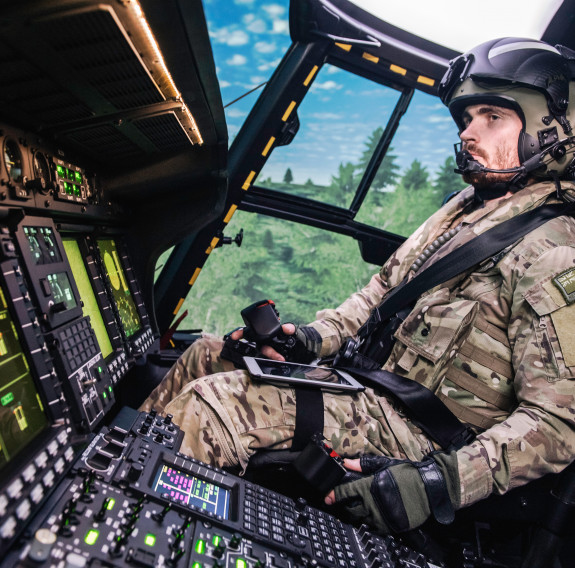 A member of the Royal New Zealand Air Force's No. 3 Squadron in the NH90 simulator. The image is side a side angle, taken on the lefthand side of the person.