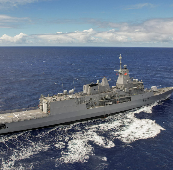 A drone shot of HMNZS Te Mana at sea on the journey back to New Zealand.