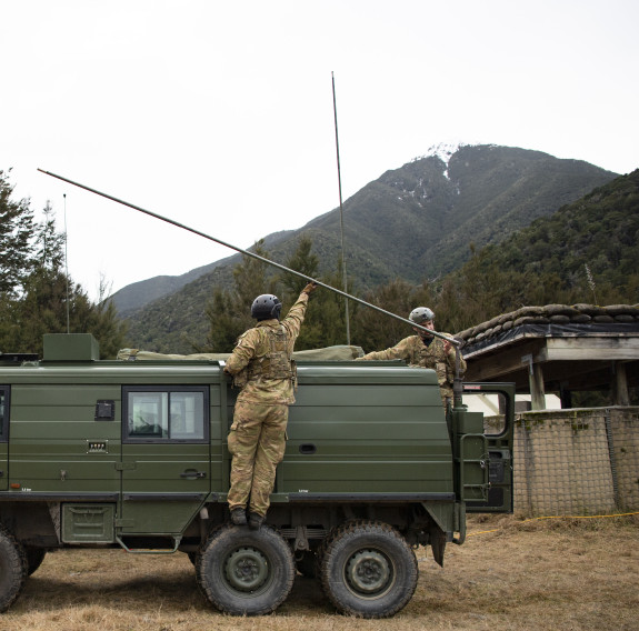 Two students set up the Pinzgauer in the field.