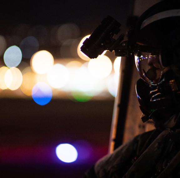 A No. 3 Squadron Helicopter Loadmaster looks into the Wellington landscape