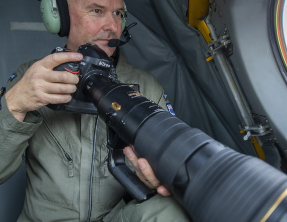 W/O Aaron Grocott using a camera as part of his role inside the P-3K2 Orion