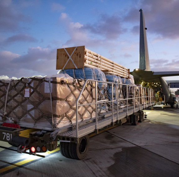 A RNZAF C-130 Hercules is loaded with critical supplies for Kiribati and Fiji