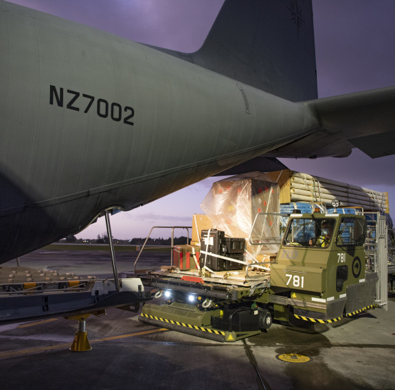 A RNZAF C-130 Hercules is loaded with critical supplies for Kiribati and Fiji