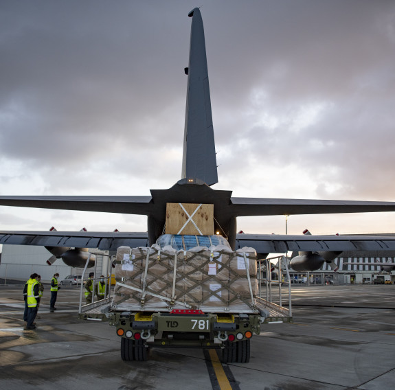 A RNZAF C-130 Hercules is loaded with critical supplies for Kiribati and Fiji