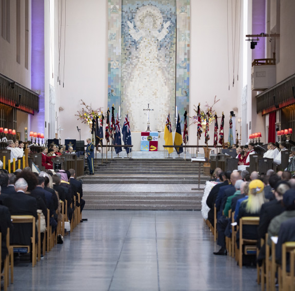 The Queen’s Colours and Her Majesty’s Personal Flag for New Zealand stand tall in the Wellington Cathedral of St Paul