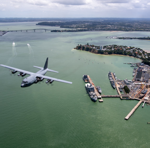 NZ7003 flies over Devonport Naval Base in Auckland.