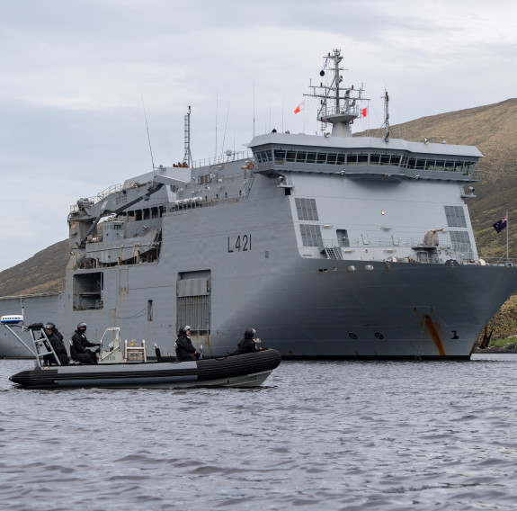 Zodiac inflatable boat in front of HMNZS Canterbury during Op Endurance. 