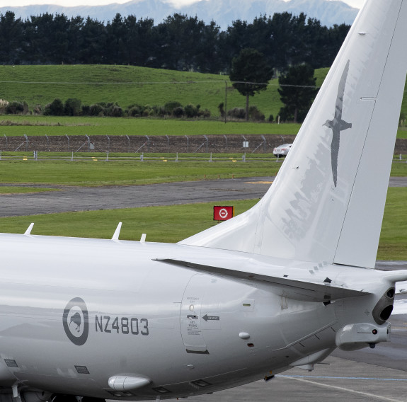 Now parked, the tail and rear of the aircraft it displayed, including the RNZAF roundel and the aircraft identifier 'NZ4603'.