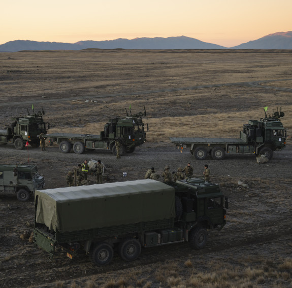 Army vehicles parked in the Tekapo Military Training Area at sunset,