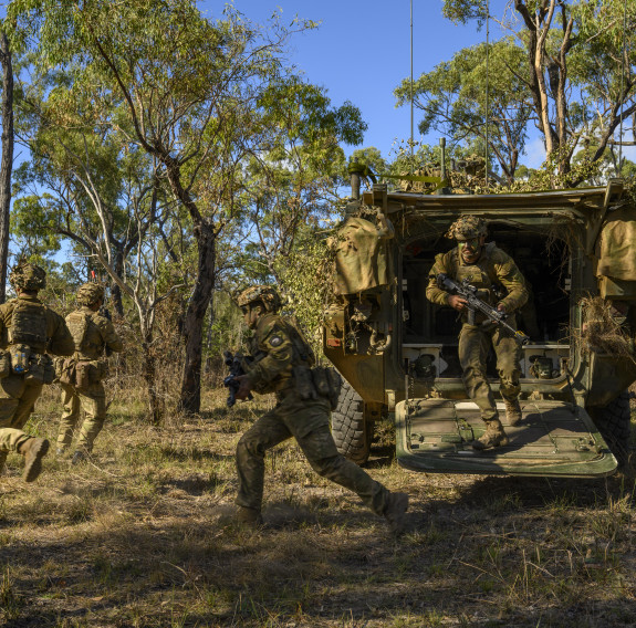 NZ Army soldiers exiting an NZ LAV during field training as part of a tactical dismount as part of Exercise Talisman Sabre