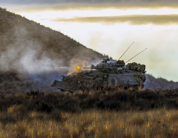 A New Zealand Army Light Armoured Vehicle fires its 25mm cannon during the final defensive battle of Exercise Crete  