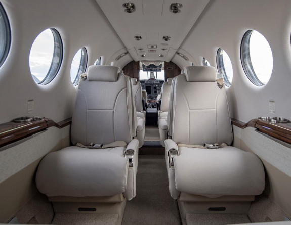 Two pale coloured seats inside a Royal New Zealand Air Force King Air 350 aircraft