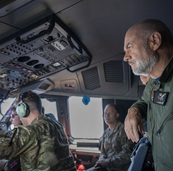 A Royal New Zealand Air Force aviator looks out the window of a Royal Air Force A400M Atlas during a familiarisation flight over Hawaii during Mobility Guardian 23. 