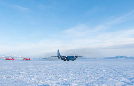 A Royal New Zealand Air Force C-130 Hercules in Antarctica sitting on the ice